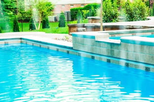 G36 fiberglass pool in california with a tanning ledge and waterfall