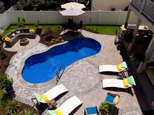 River Pools I25 in Maya Shimmer with concrete paver patio and coping
