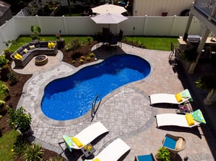 River Pools I25 in Maya Shimmer with concrete paver patio and coping