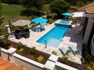  River Pools M30 + SS08 with spillway in Caribbean Sparkle with natural stone patio and coping