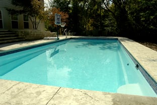 R36 pool in Arctic with textured concrete deck and waterline tile