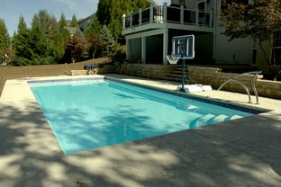 R36 pool in Arctic with textured concrete deck and waterline tile