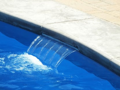 Cascade water feature on swimming pool 