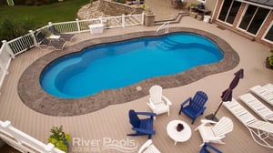 C40 fiberglass pool with deck chairs