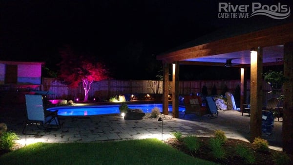 multi-colored pool and patio lighting at night