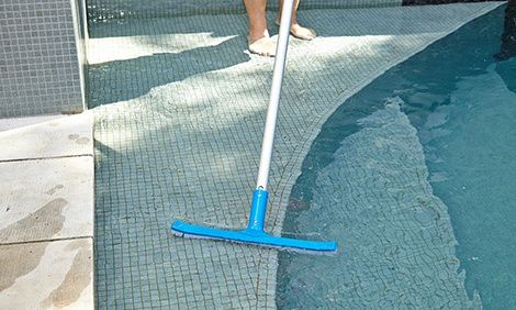 Brushing the pool surface