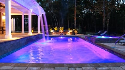 deep-end rectangular fiberglass pool (T40) with multicolored in-pool lights and water features