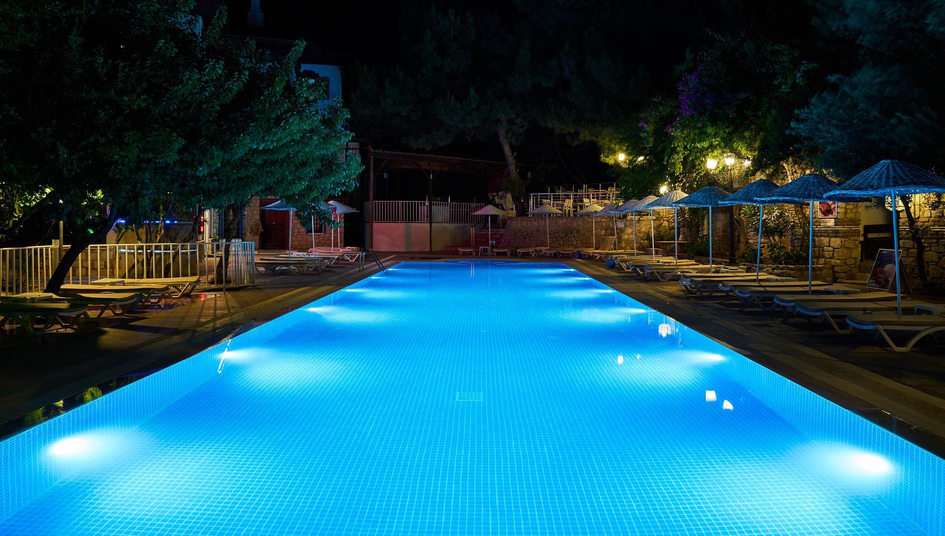 swimming pool lights in pool at night