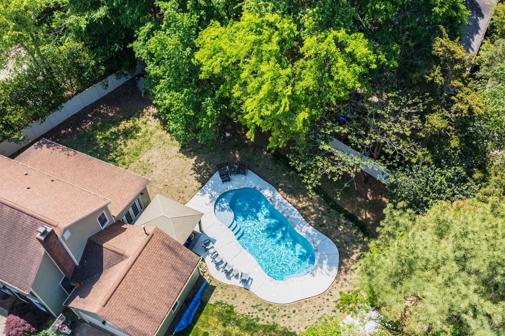 River Pools C35 in Diamond color with brushed concrete and natural stone coping