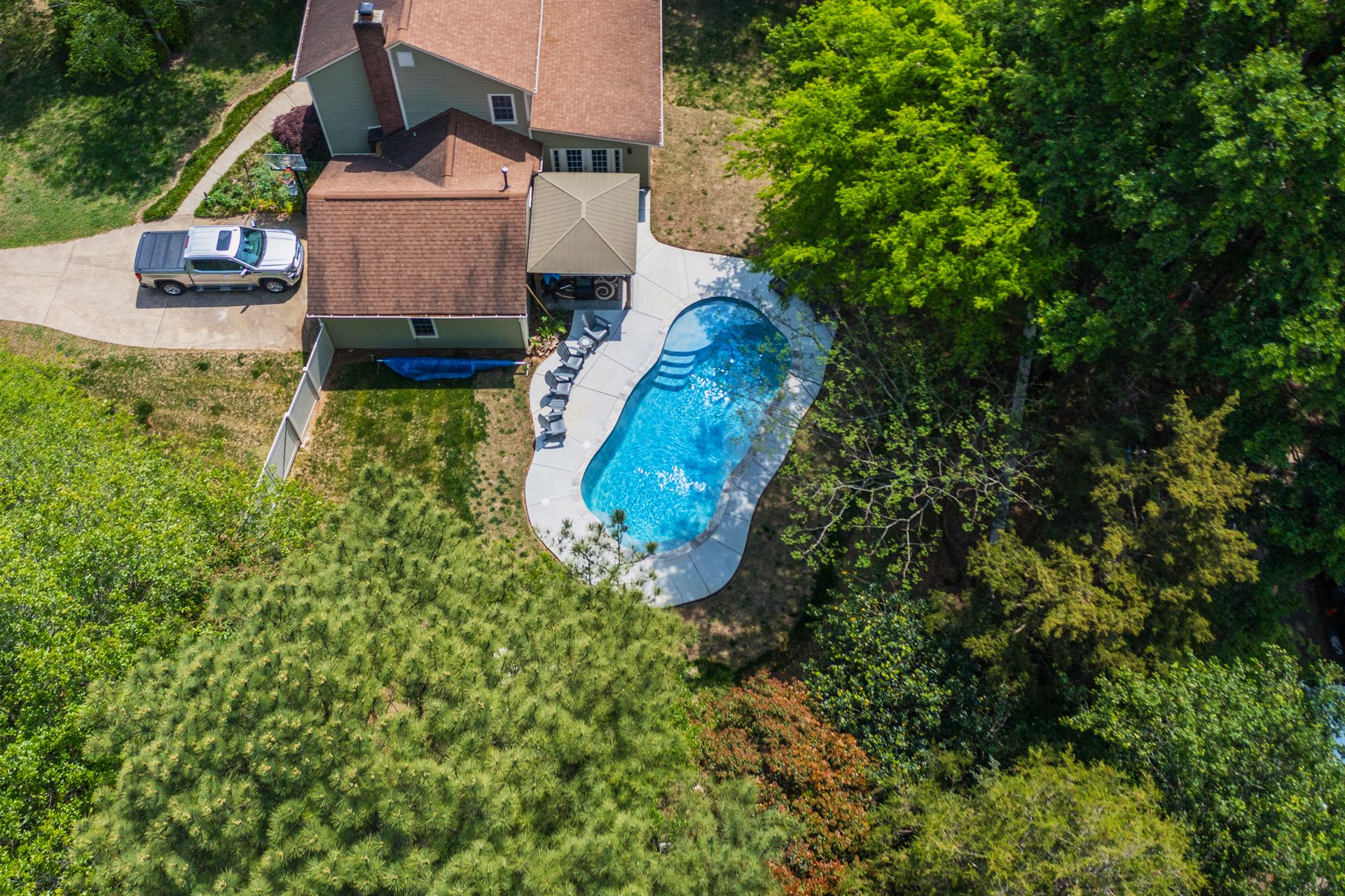 River Pools C35 in Diamond color with brushed concrete and natural stone coping