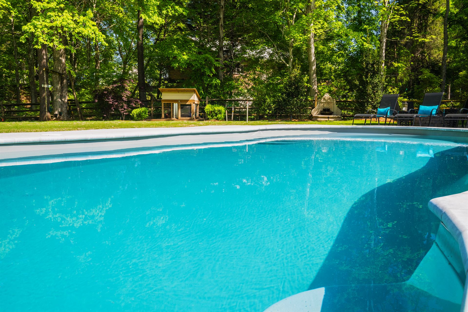 River Pools C40 in Diamond color with brushed concrete and natural stone coping