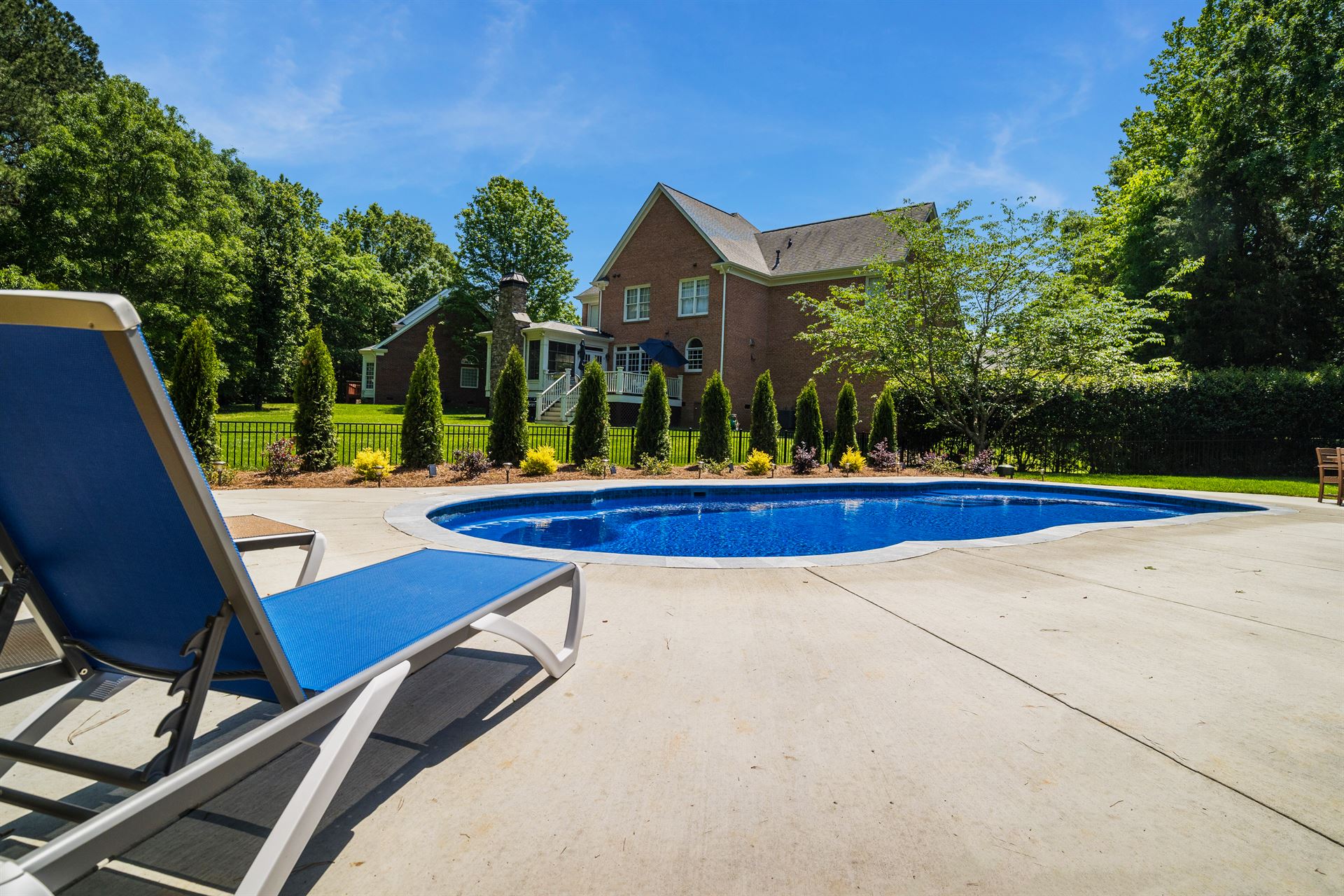 River Pools C40 in Maya Shimmer with brushed concrete and natural stone coping