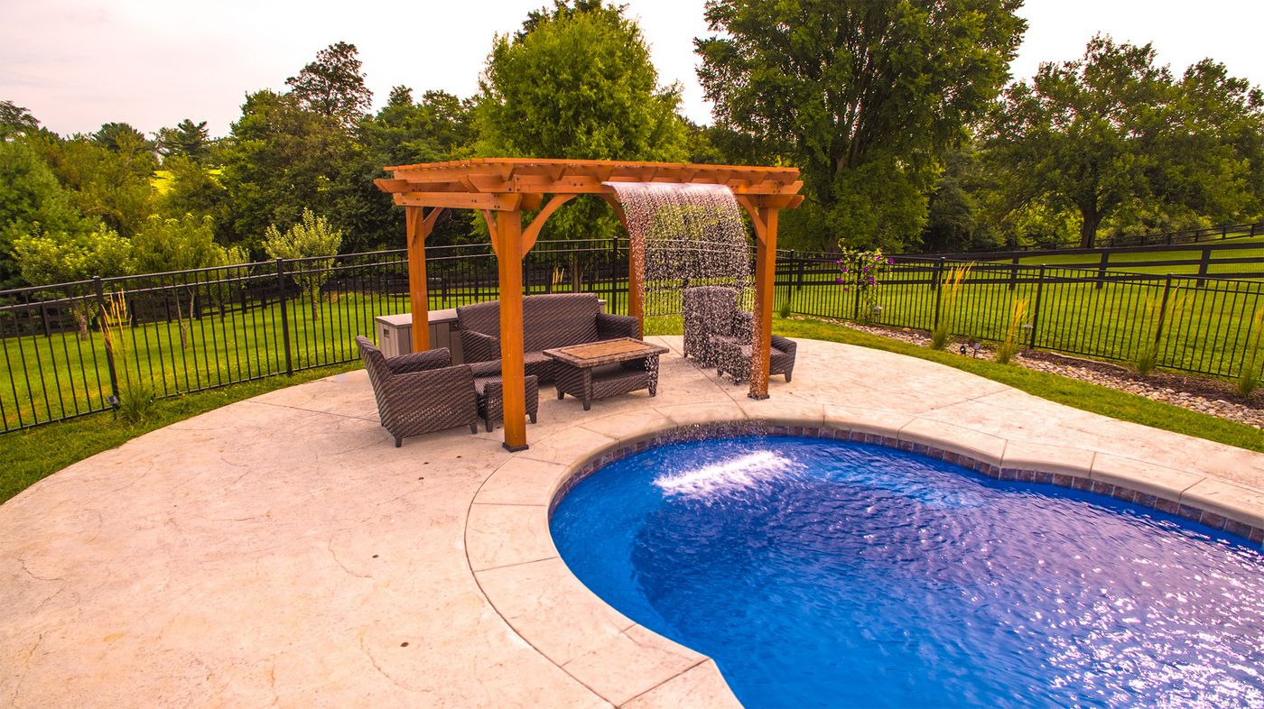 C40 pool with shade structure and rain fall water feature