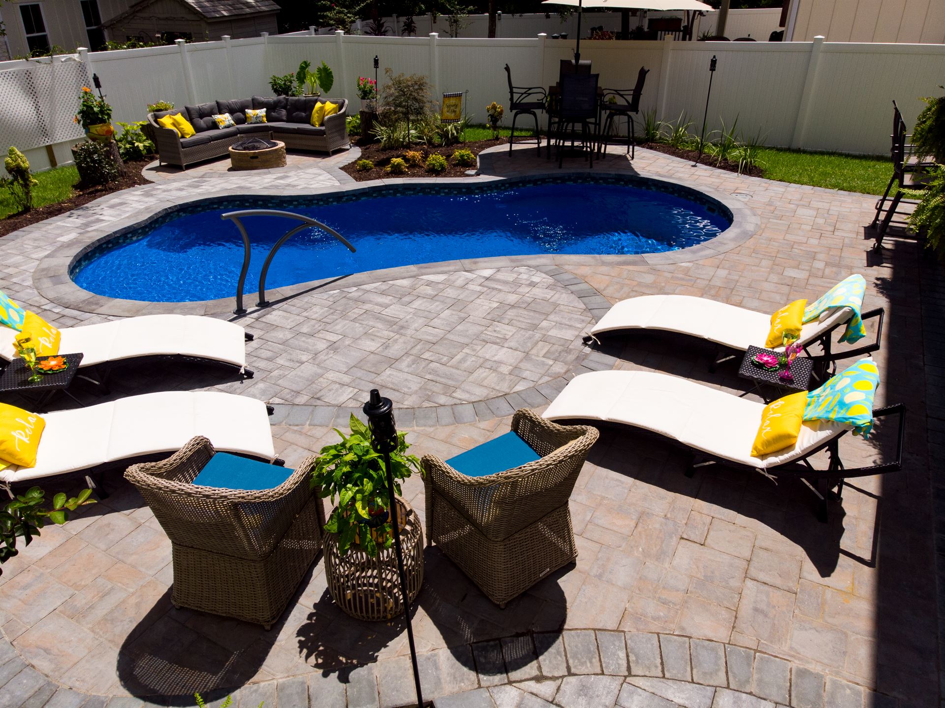 River Pools I25 in Maya Shimmer with concrete paver patio and coping