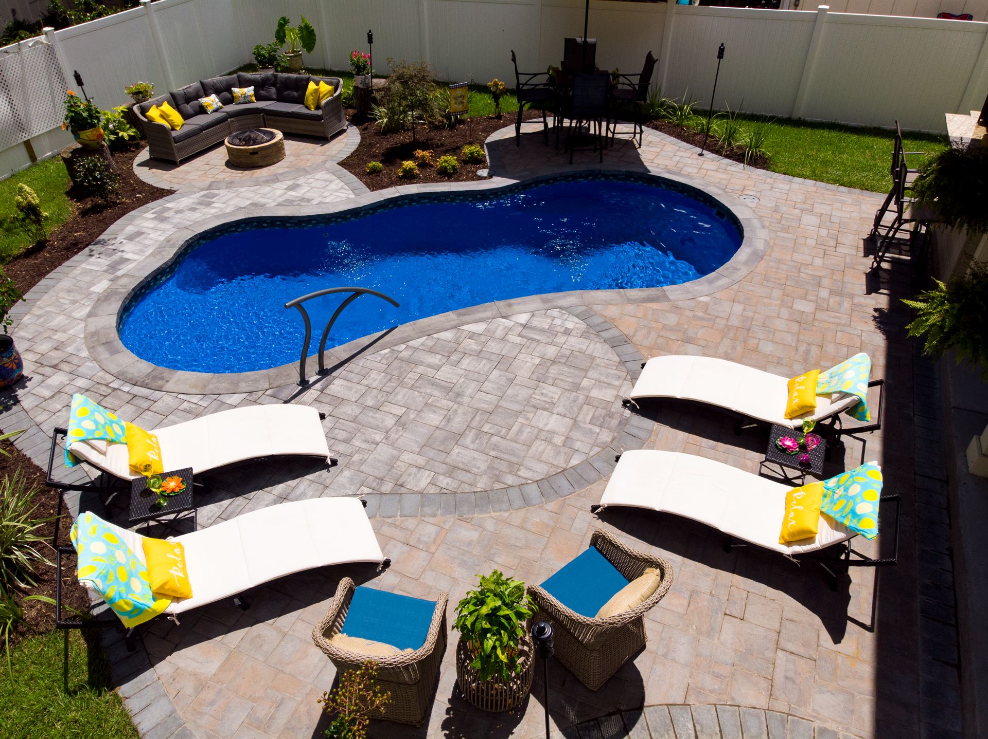River Pools I25 in Maya Shimmer with concrete paver patio and coping