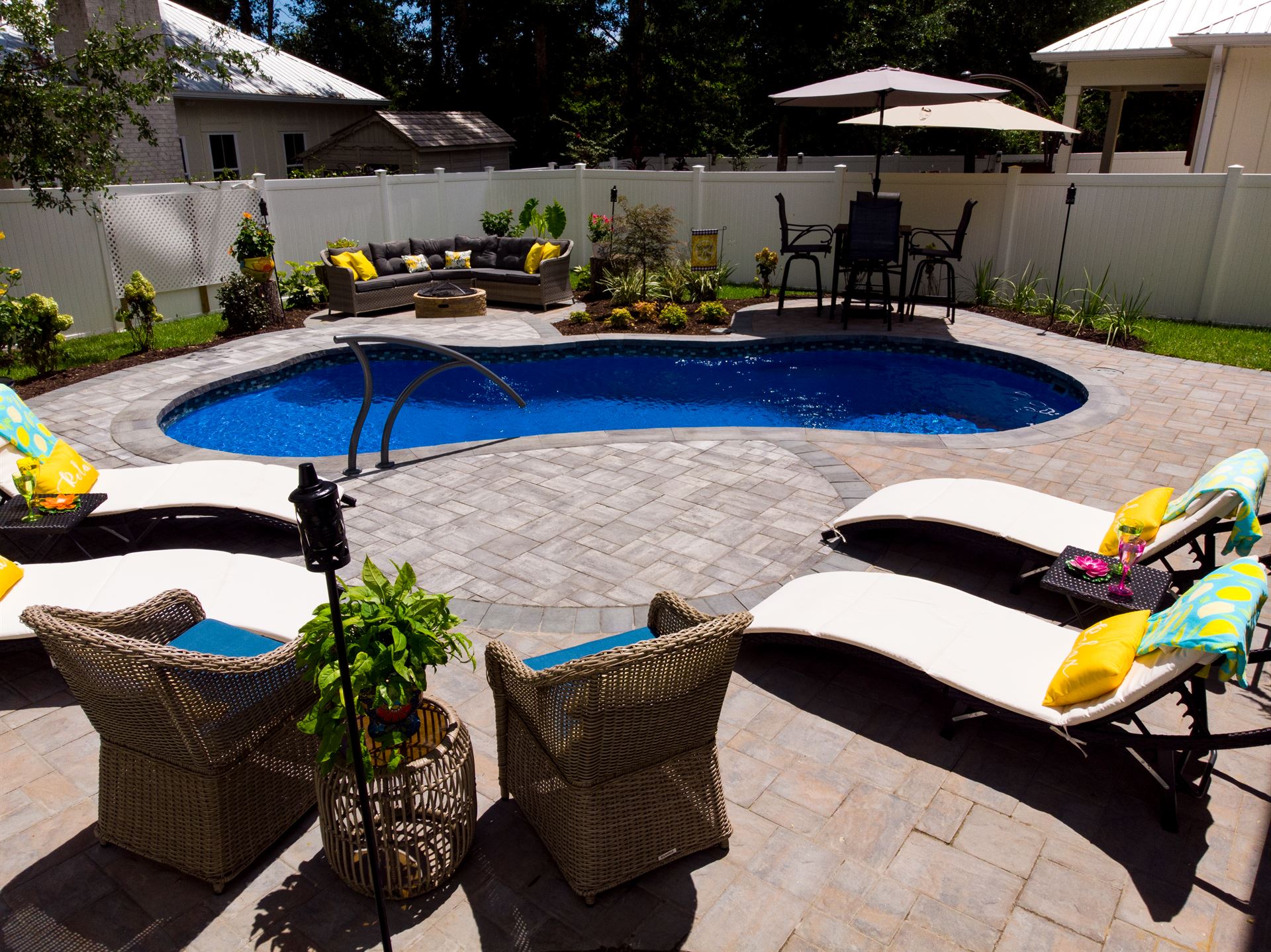 River Pools I25 in Maya Shimmer with concrete paver patio and coping