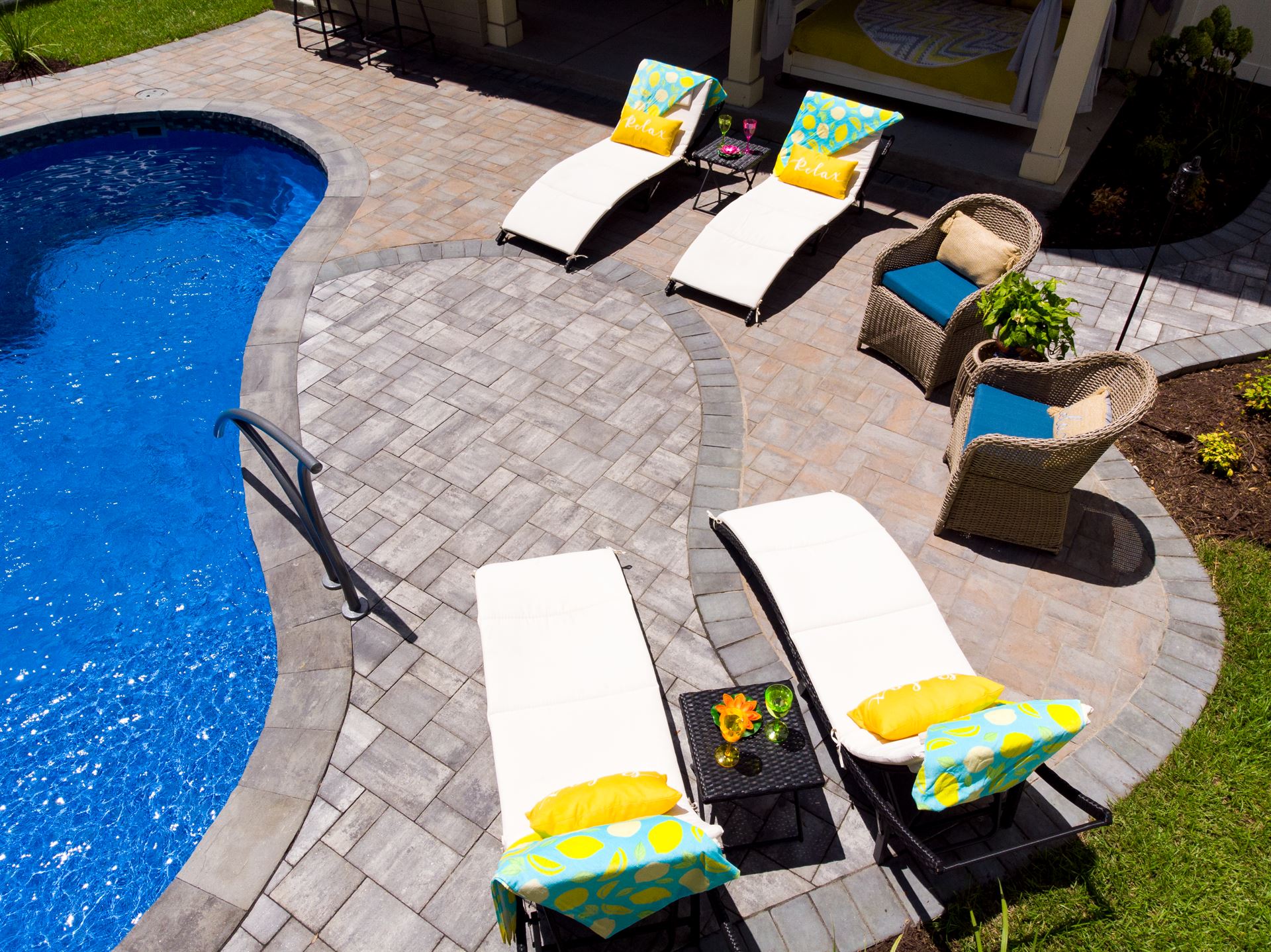 River Pools I25 in Maya Shimmer with concrete paver patio and coping