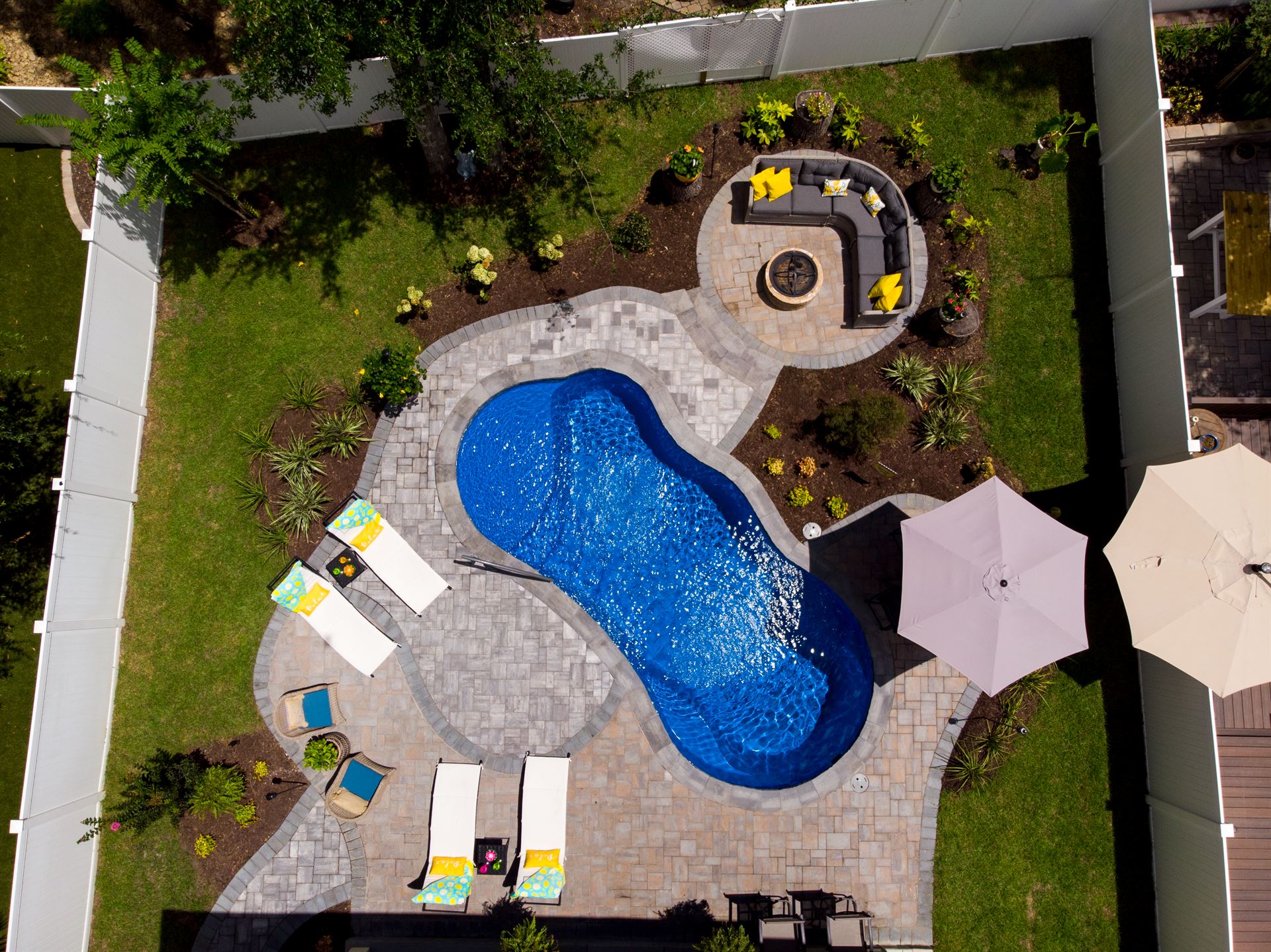 River Pools I25 in Maya Shimmer with concrete paver patio and coping