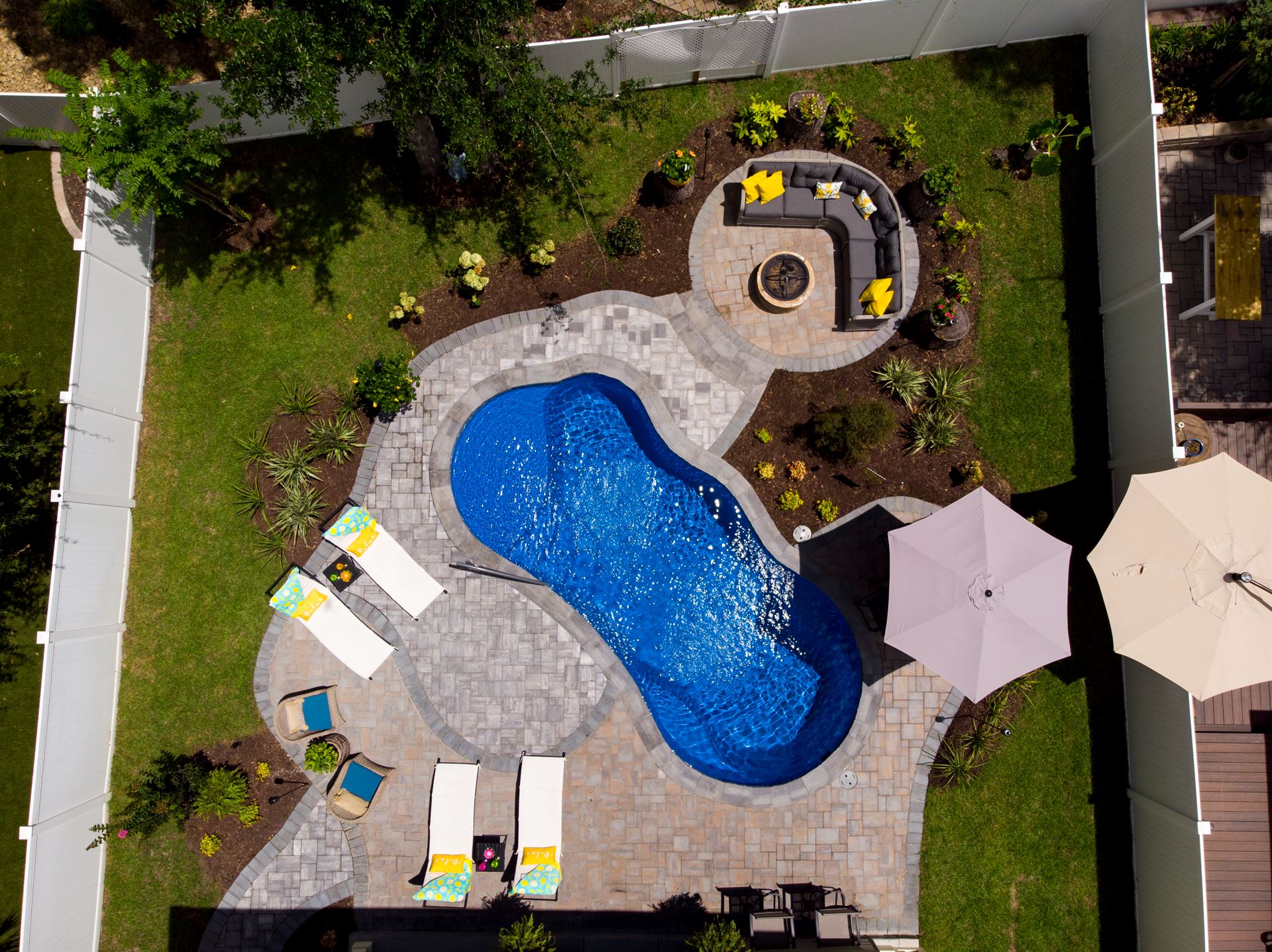 River Pools I25 in Maya Shimmer with concrete paver patio and coping