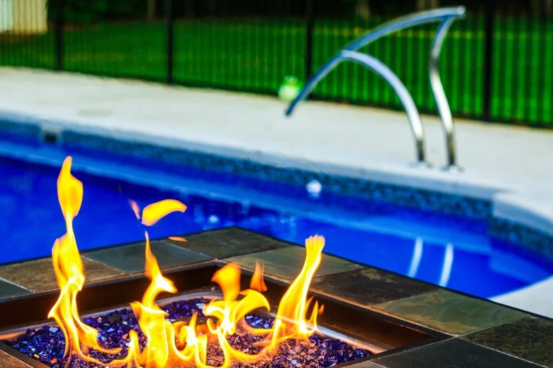 Relax in by the fire on the tanning ledge of our L36 pool