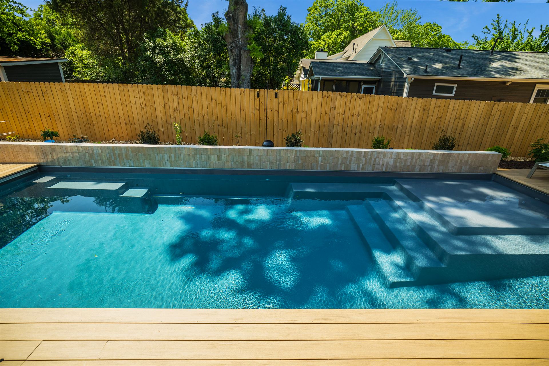 River Pools M35 in Diamond with composite wood patio and coping