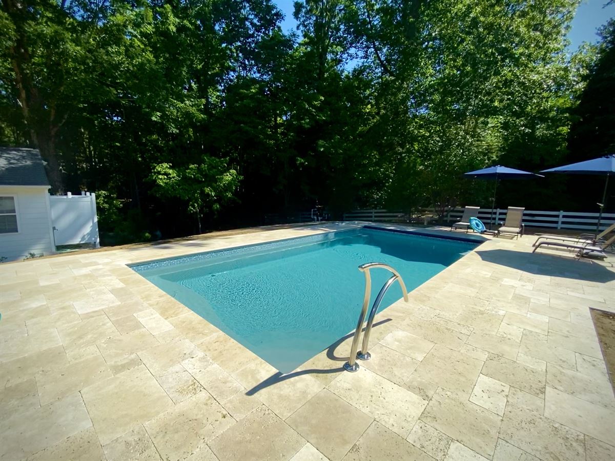 R28 pool in Diamond with travertine decking