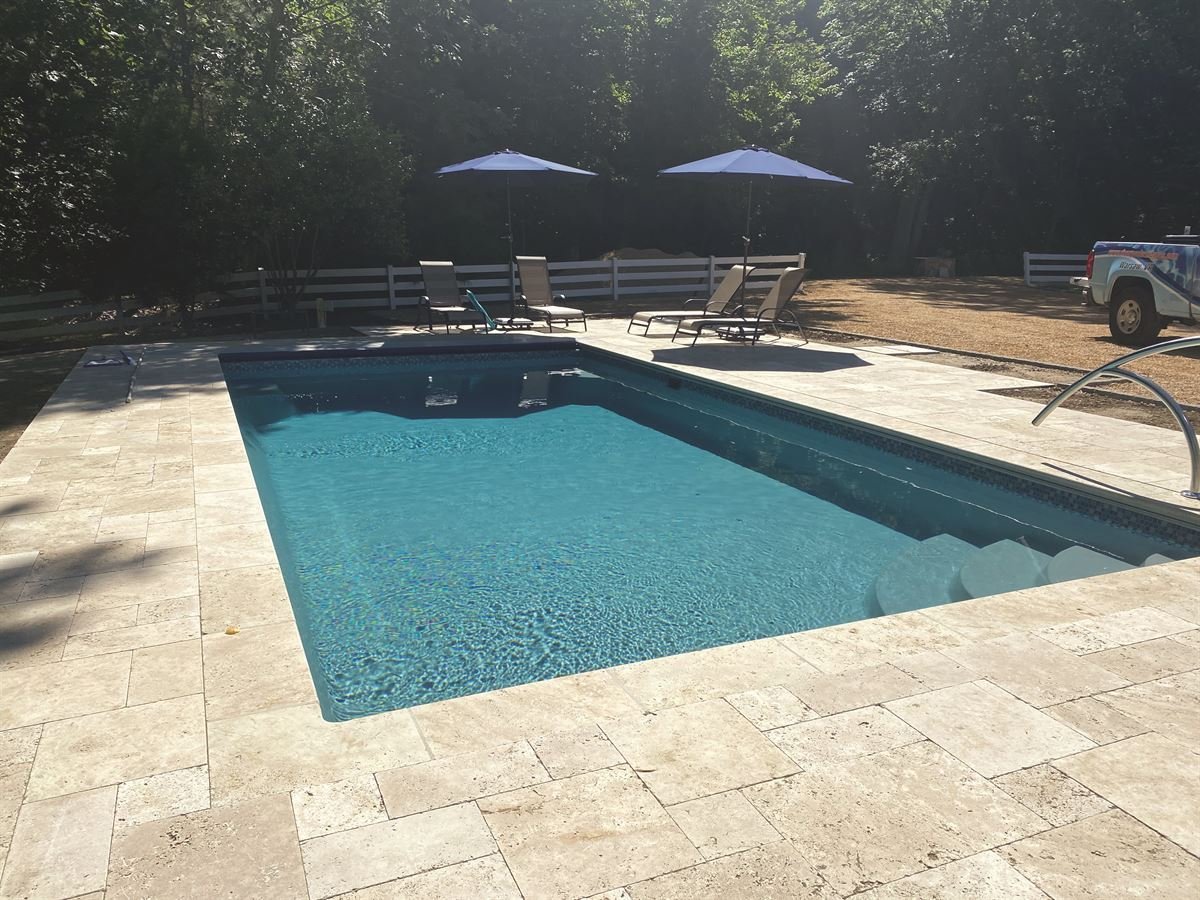 R28 pool in Diamond with travertine decking