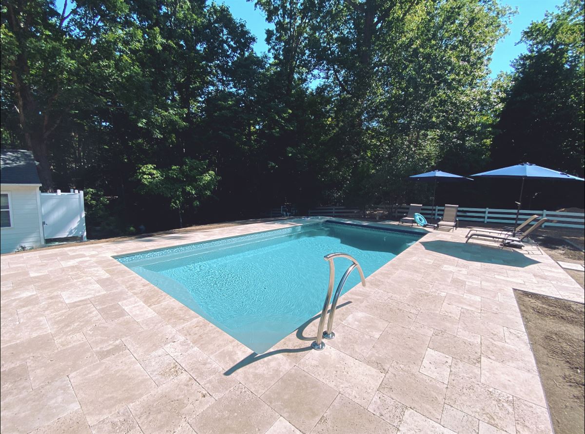 R28 pool in Diamond with travertine decking