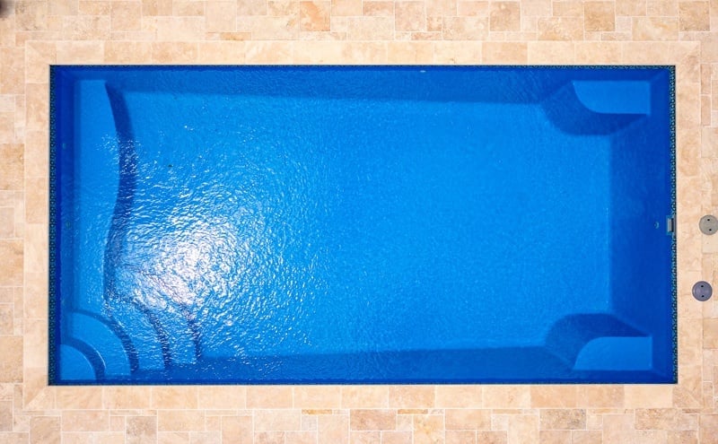 Aerial view directly over top of our R Series pool glistening in the sun