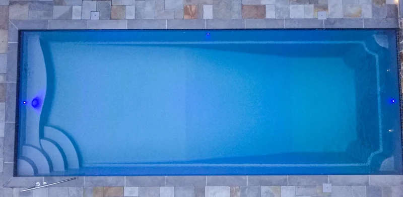 T40 pool in Granite Grey color surrounded by Bluestone coping