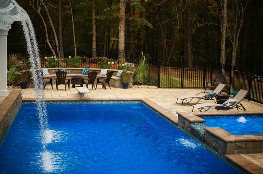 Gorgeous view of the T40 pool with a waterfall, a tanning ledge with bubblers and a spillway